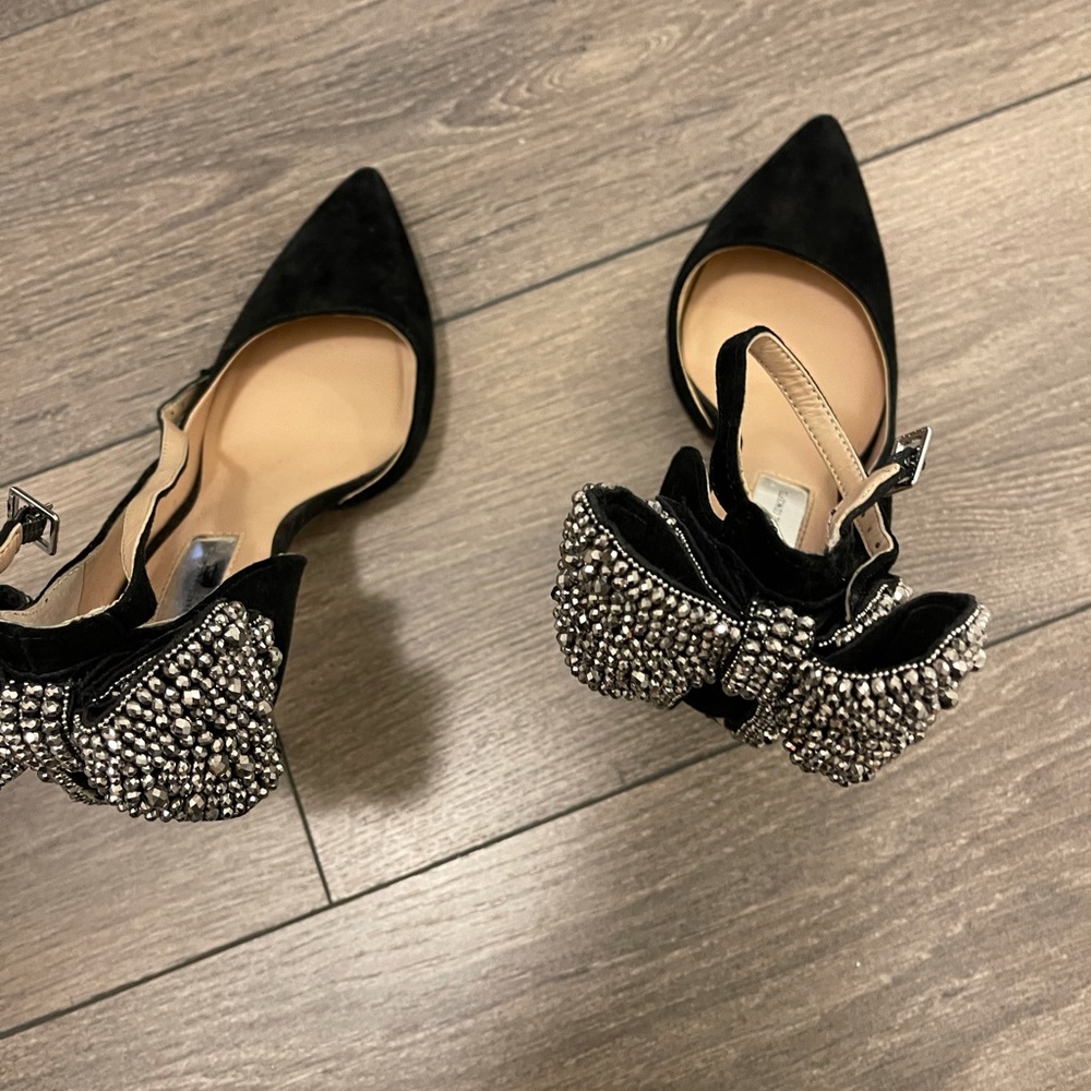Inc black heels with embellished beaded bow in back to complete your look